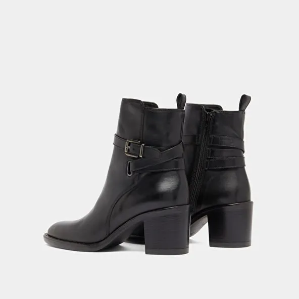 Heeled ankle boots and buckles in black leather